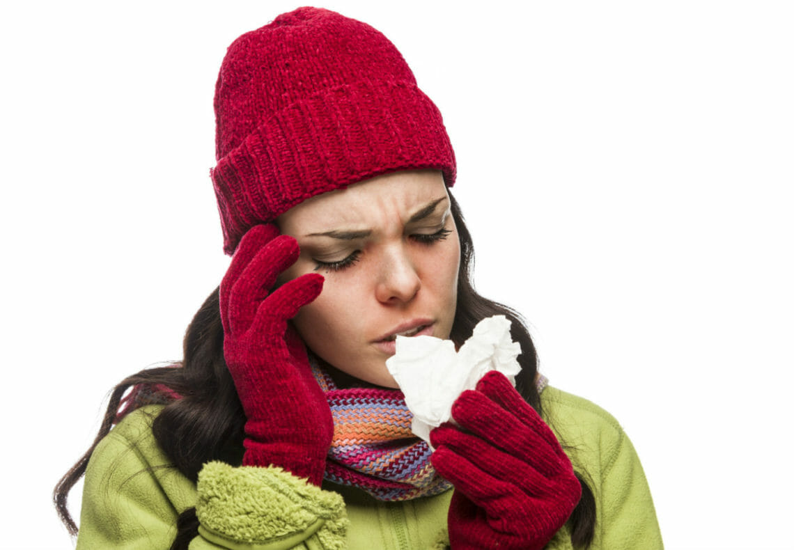 Woman with a head cold